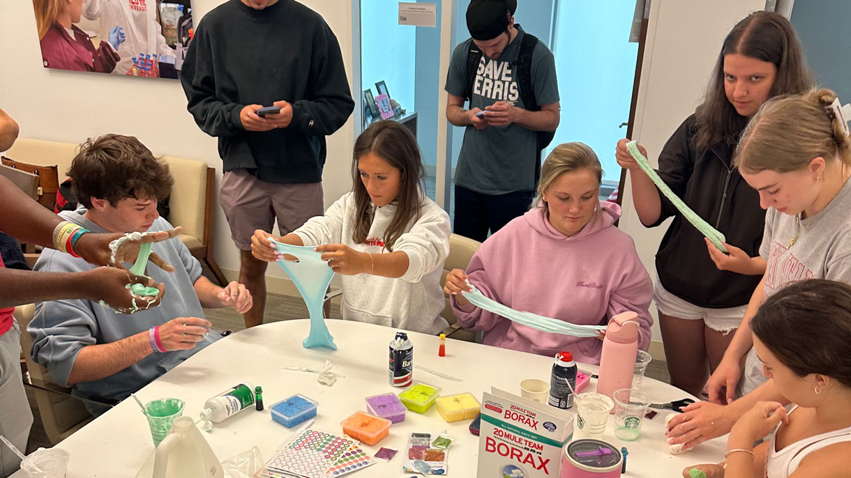 Group of students playing with slime