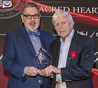 Dr. Petillo photographed with Alumni