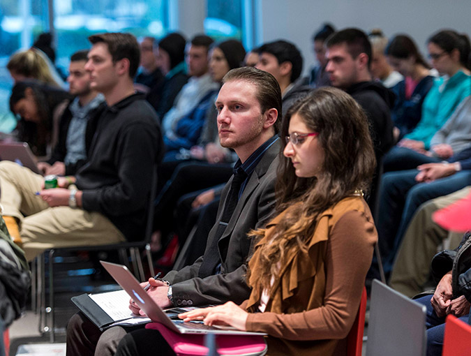 Students sitting in atrium