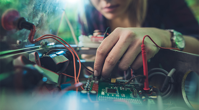 Student working on something electrical 