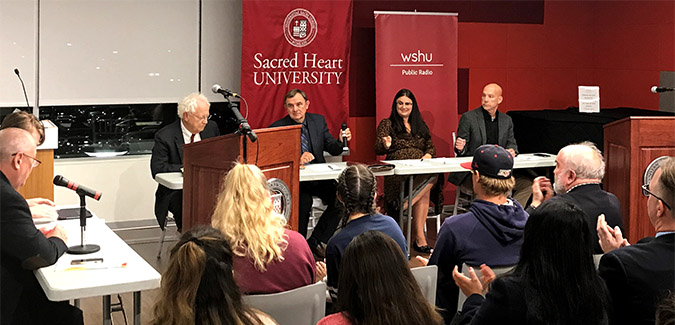 Panel of people debating