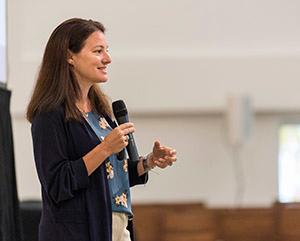 Lady speaking into microphone