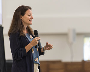 Lady speaking into microphone
