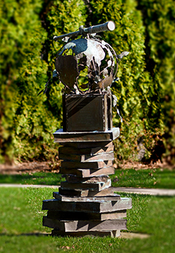 academic statue of globe and books