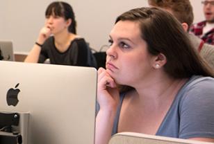 student listening in a classroom