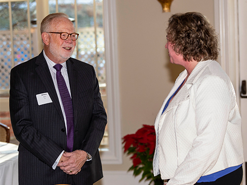 Bill Haas talks with a Center for Nonprofits conference attendee