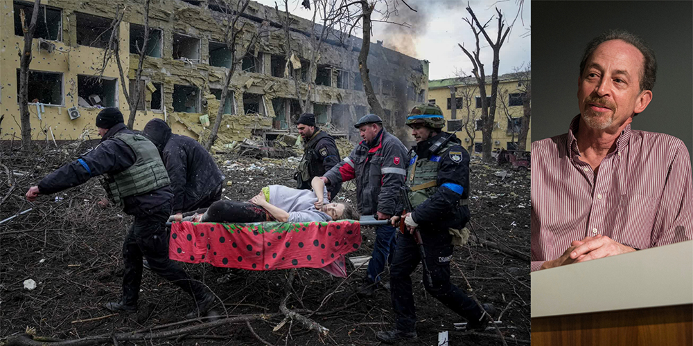 men carry an injured pregnant woman in the Russia Ukraine war. Photo of Rick Falco