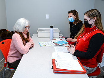 Marti Kosh works with Professor Marta Korytkowska and student Grace Carey