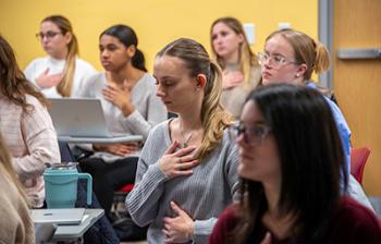 Nursing students doing breathing techniques and meditation