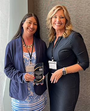 Donna Sheperis presents the AARC Exemplary Assessment and Evaluation Practices Award to Professor Sandra Logan-McKibben