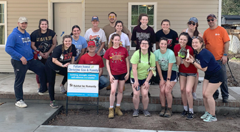 college students who volunteer with Habitat for Humanity