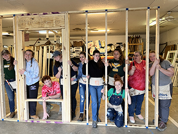 college students who volunteer with Habitat for Humanity