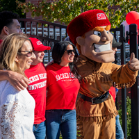 Family posing with Big Red