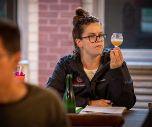 Woman looking at beer