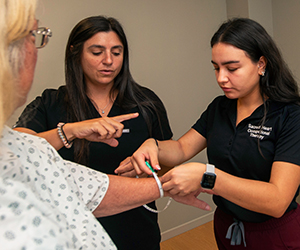 Professor and student with patient