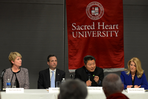 Panel of people talking in microphones