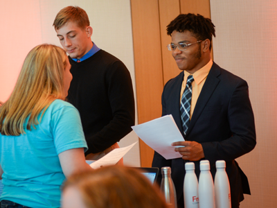 Students talking to professionals at career fair