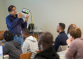 Professor explaining equipment to class