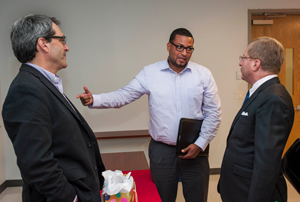 Three men talking