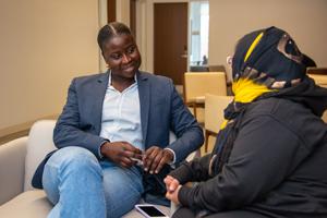 Two women sitting and talking