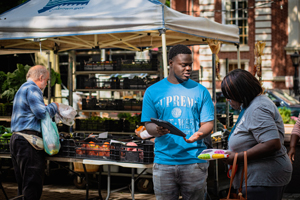 People shopping at farmers market