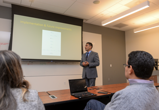 Digital marketing graduate student Ayman Abdelmawla presents his final project