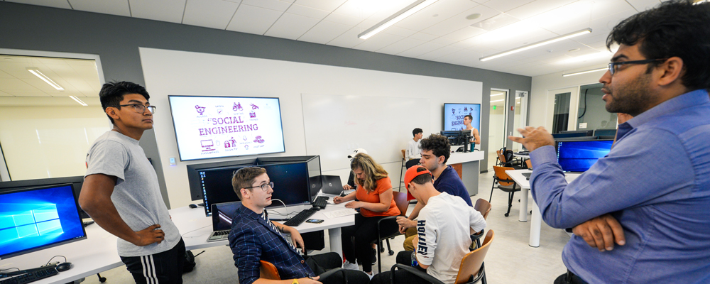 Professor Speaking to Group of Students