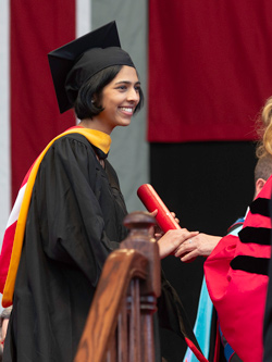 Graduate getting diploma at Commencement