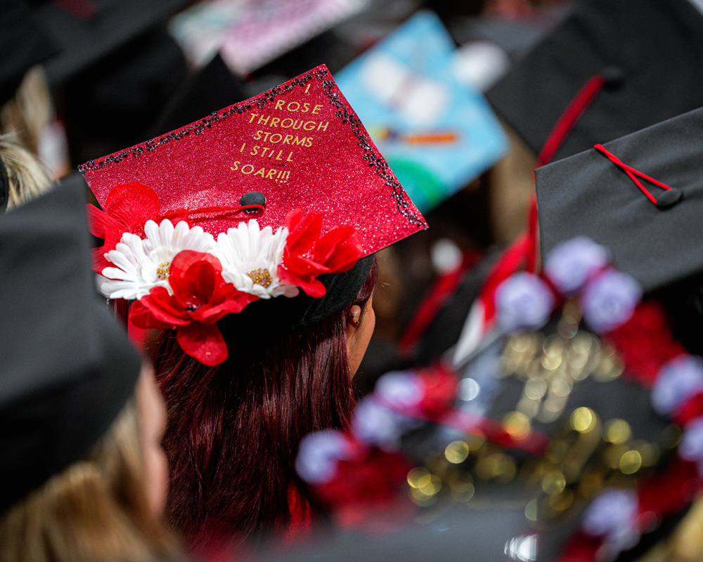 Graduation cap that says I rose through storms I still soar!