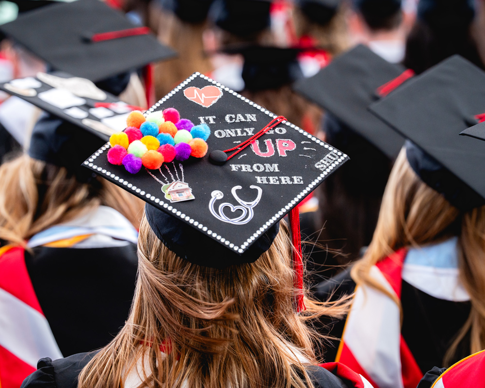 Graduation cap that says It can only go up from here