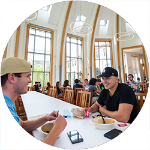 two people eating in a college dining hall
