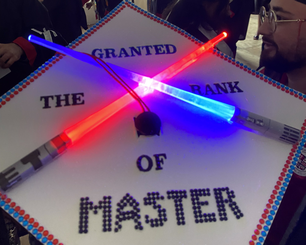 Graduation cap that says granted the rank of master
