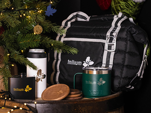 Trillium branded mugs, coasters and a bag