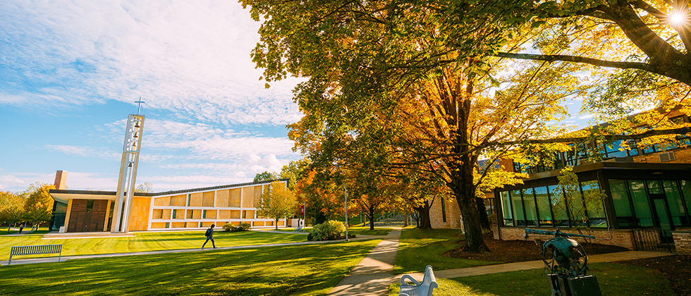 Student walking across the chapel quad