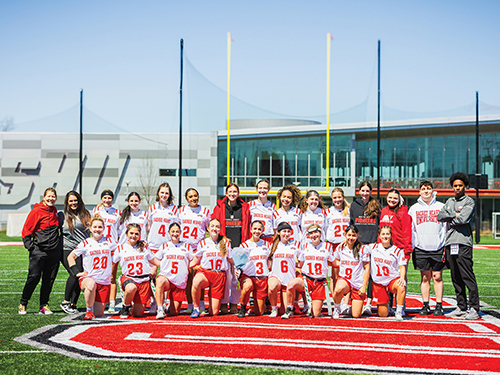 Group photo of flag football team on field