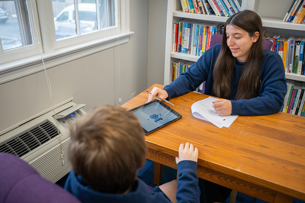 Student providing a dyslexia screening to child