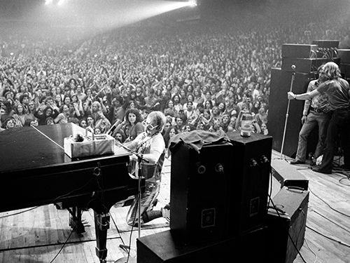 Elton John performing on stage