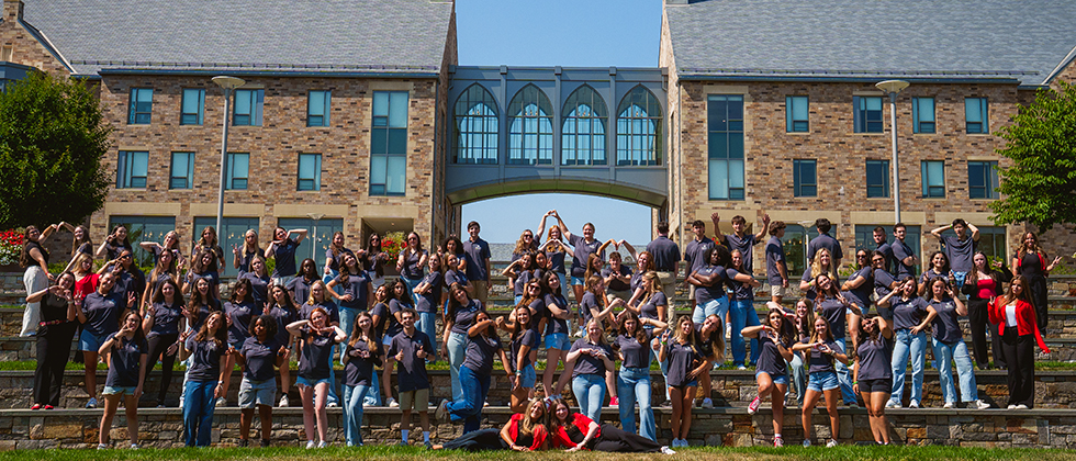 Group photo of student ambassadors on amphitheater steps