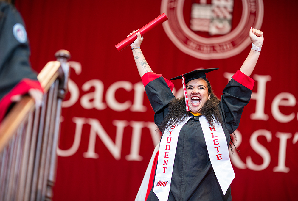 Graduate celebrating after getting diploma