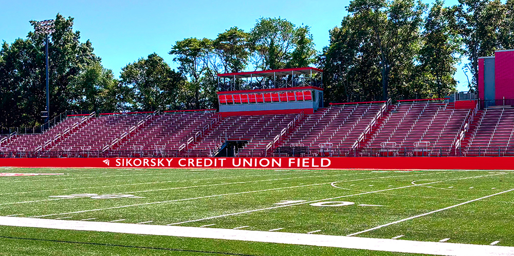 football field with bleachers showing the name Sikorsky Credit Union Field