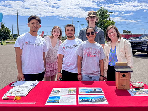 SHU professor and students at a press event at Manresa Wilds