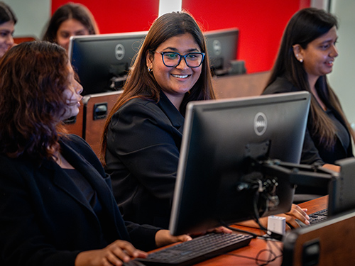 Students in class using computers