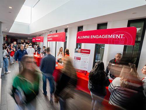 people walking through a college open house