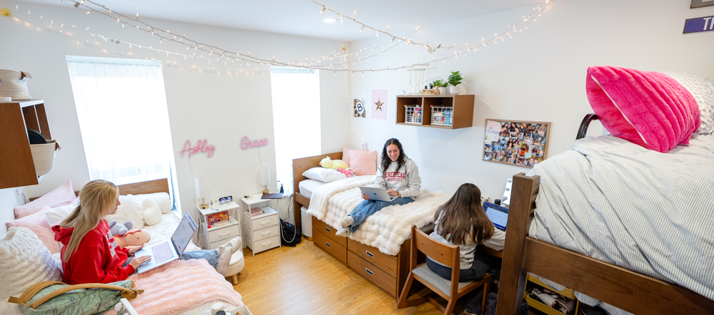 Students hanging out in a dorm room