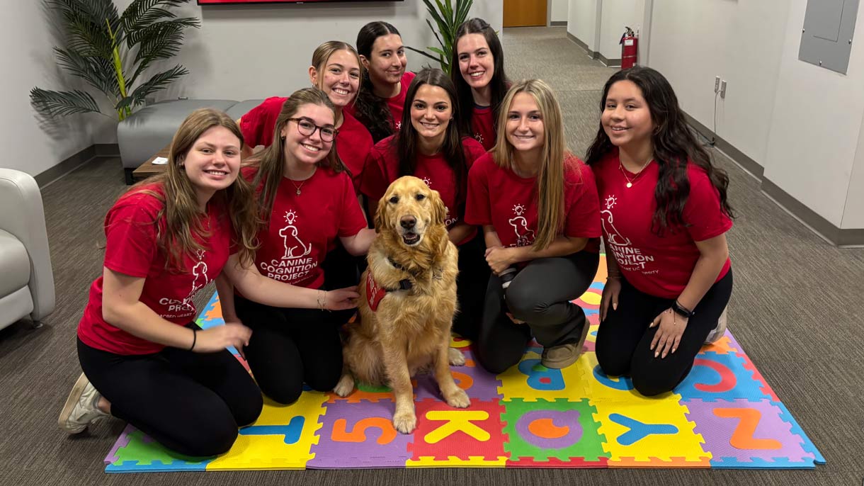 Student researchers with Golden Retriever