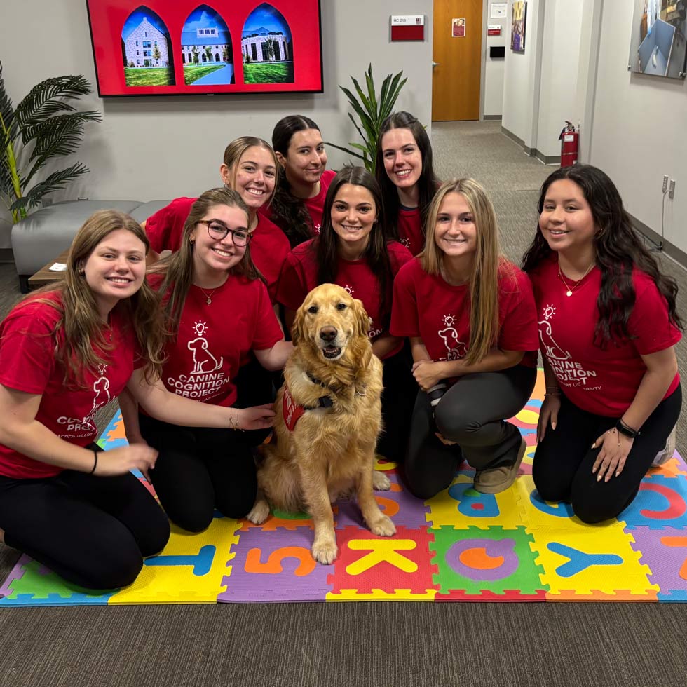 Student researchers with Golden Retriever
