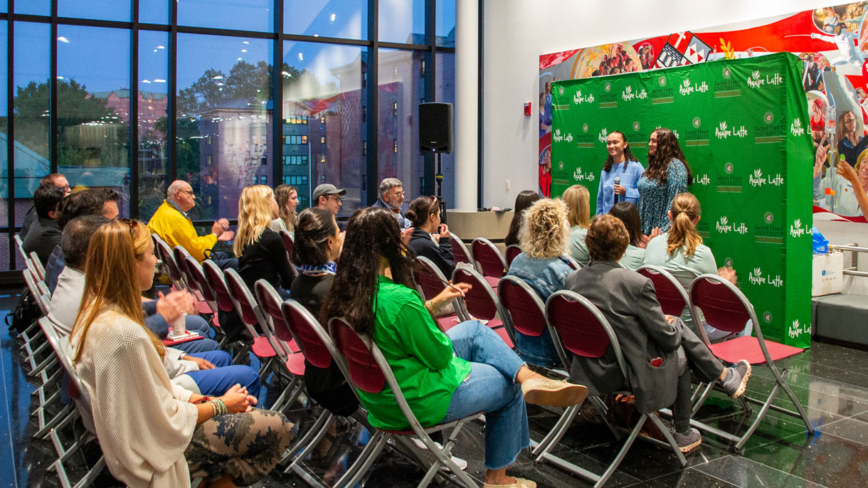 Audience listening to speakers