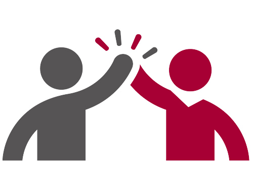 two people giving each other a high five