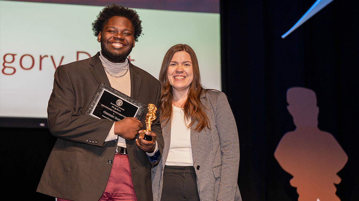 two people at an award ceremony