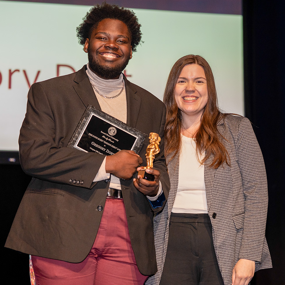 two people at an award ceremony
